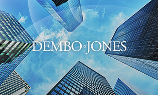 Looking up at skyscrapers into the sky with Dembo Jones logo