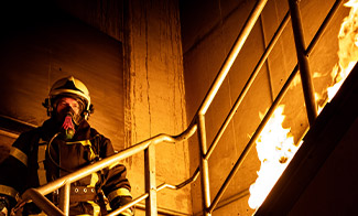 fireman approaching fire in stairwell