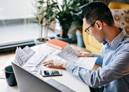 asian american man working at desk