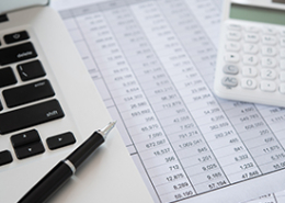 Computer-with-pen-and-calculator-tax-preparation