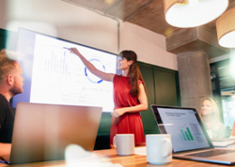 woman-at-white-board-making-presentatio-