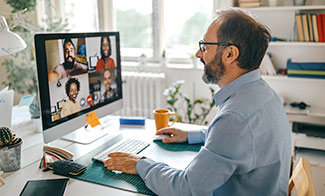 man-in-home-office-on-video-call
