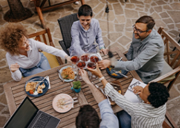 business-associates-toasting-at-dinner-table