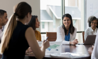 woman-leading-meeting-in-conference-room