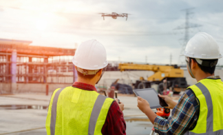 two-construction-workers-operating-a-drone