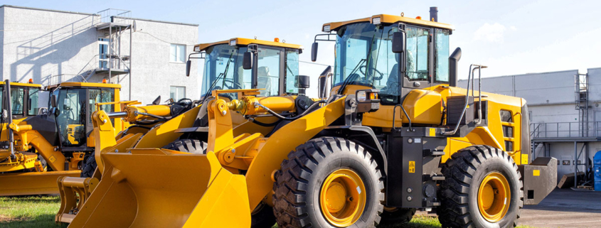 line-up-of-yellow-construction-tractors